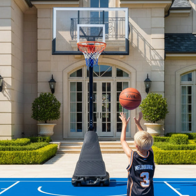 Basketball hoop with clear backboard and orange rim on a white background